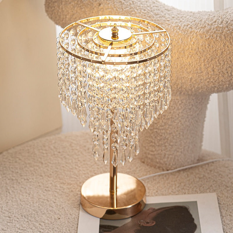 Decorative table lamp with crystal accents on a soft surface