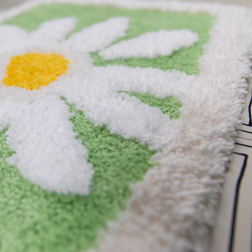 Close-up of a textured fabric with floral pattern