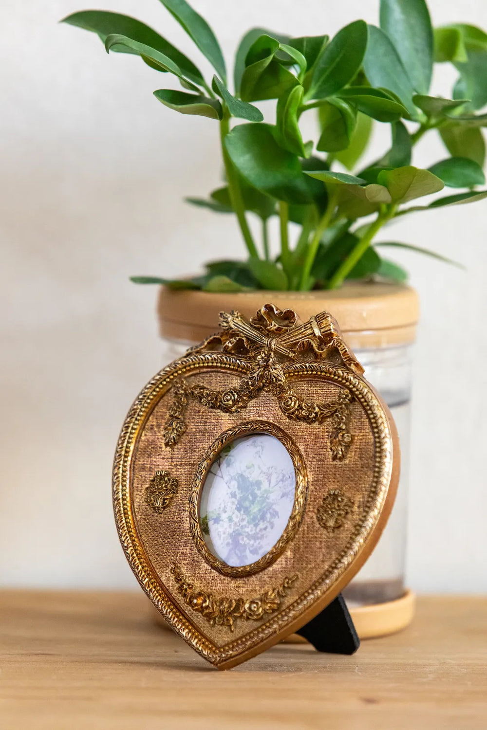 An ornate gold heart-shaped picture frame 