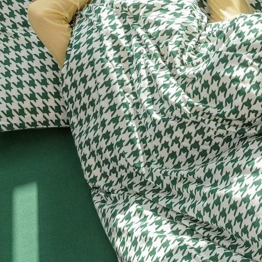 Green quilt cover with bold woven pattern